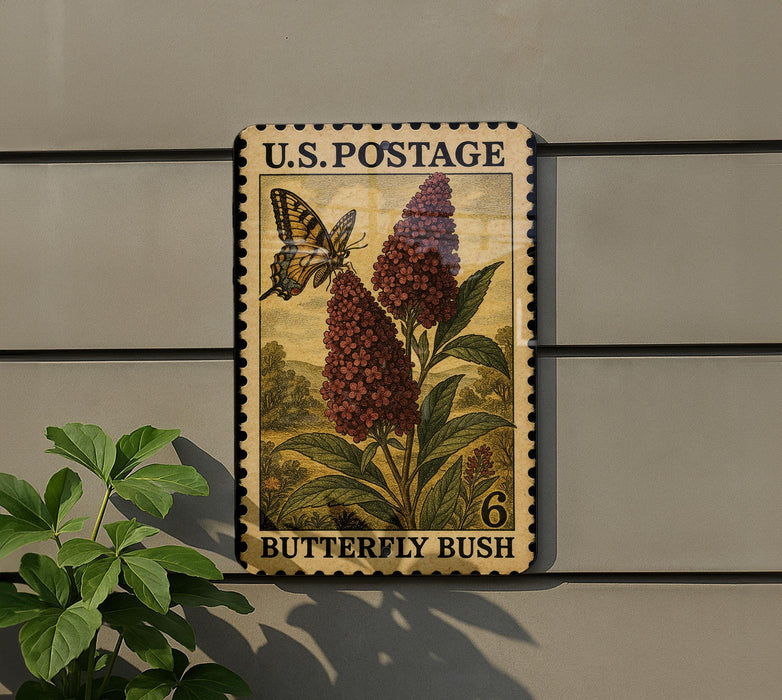 A U.S. postage stamp featuring a butterfly and a flowering bush, with the text "Butterfly Bush" and the number "6" printed on it.