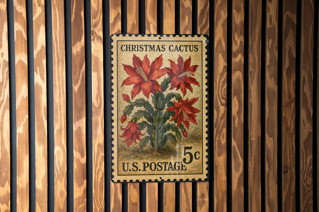 A vintage U.S. postage stamp featuring a Christmas cactus plant on a wooden background.