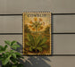 a decorative piece with a floral design, mounted on a wall next to a plant.