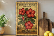 a decorative metal sign with a floral illustration of a desert rose plant, placed on a shelf next to a wooden cutting board and a potted plant.