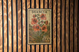 A vintage postage stamp featuring a floral illustration and the denomination of 60 cents.