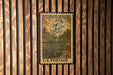 A vintage U.S. postage stamp featuring a Dutchman's breeches plant, mounted on a wooden wall.
