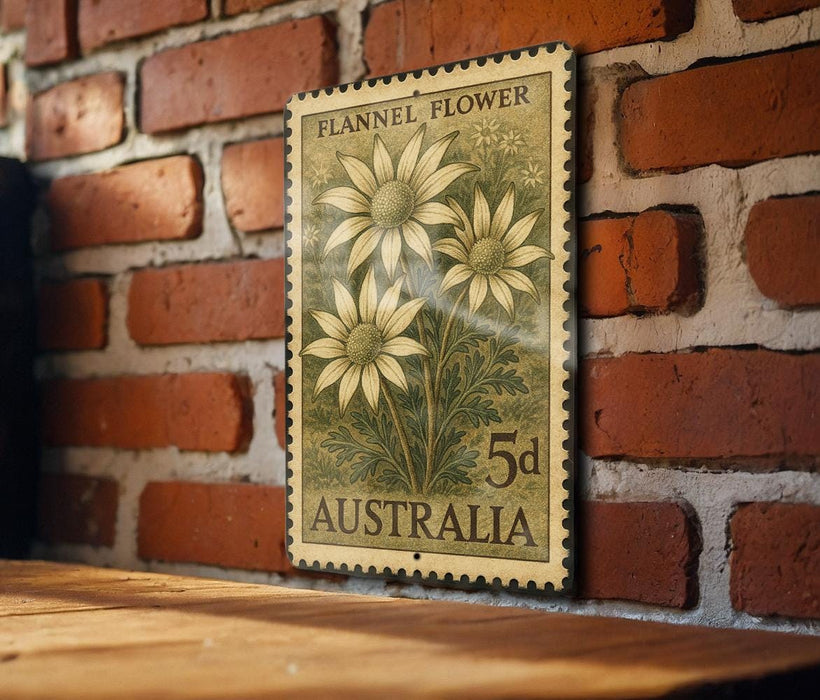 A vintage Australian postage stamp featuring a floral design is displayed on a brick wall.