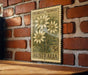 A vintage Australian postage stamp featuring a floral design is displayed on a brick wall.