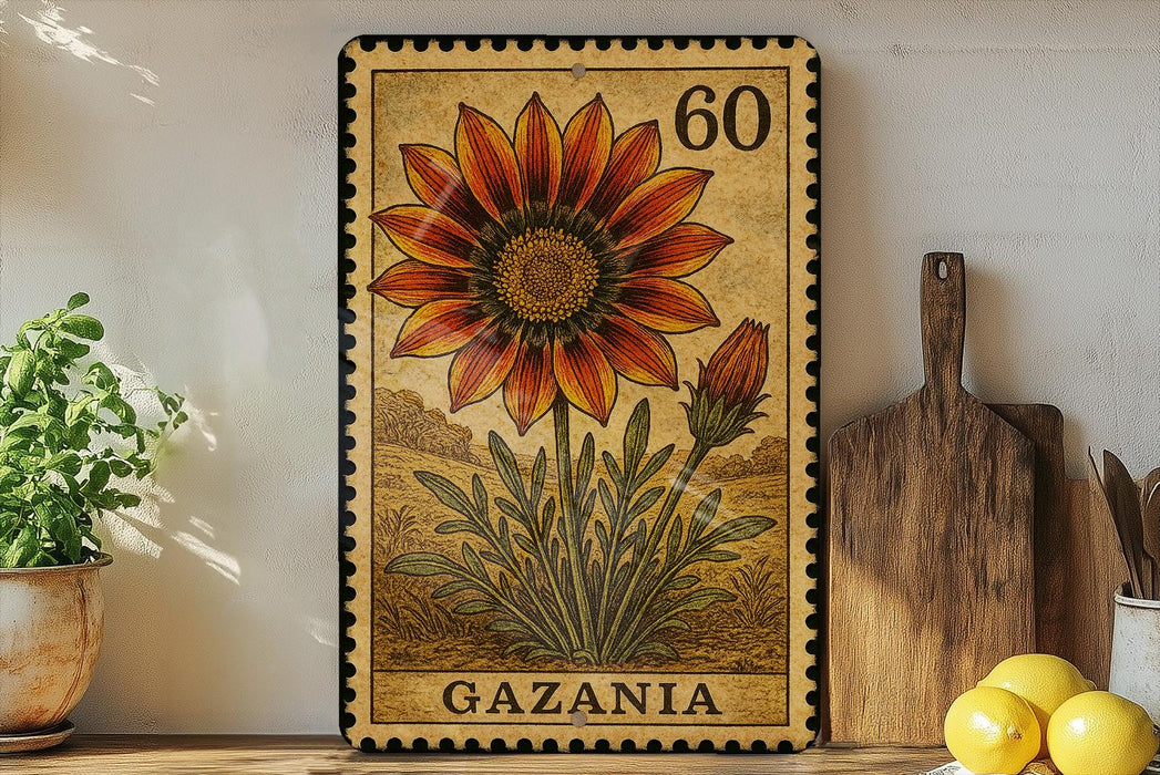 a framed illustration of a flower, specifically a Gazania, on a shelf. The frame has a stamp-like appearance and the word "Gazania" is written on it. There are also some kitchen utensils, such as a wooden cutting board and a knife, placed next to the frame.