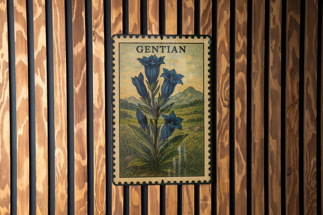 A vintage postage stamp featuring a blue bellflower is displayed on a wooden wall.