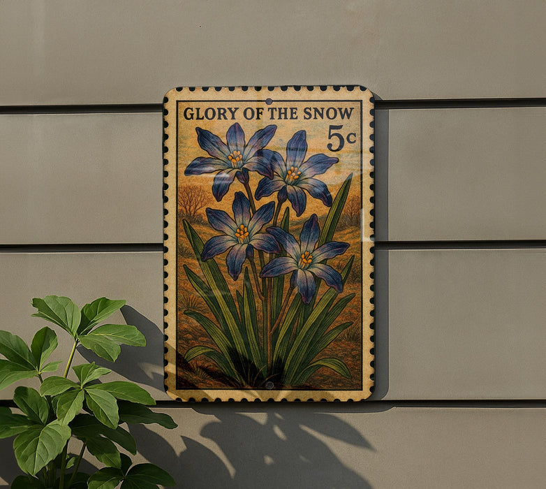 A wooden sign with a floral design hangs on a wall, featuring a large blue flower surrounded by green leaves.