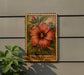 A framed illustration of a red hibiscus flower is displayed on a wall, with the word "HIBISCUS" written below it.