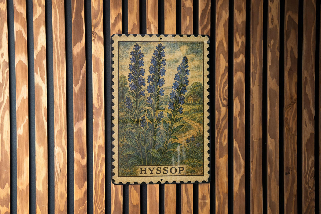 A framed illustration of blue flowers is hanging on a wooden wall.