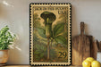 A framed illustration of a Jack-in-the-Pulpit plant from the United States, with the text "JACK-IN-THE-PULpit USA" and the number "29" printed on it. The image is displayed on a shelf next to a wooden cutting board and a potted plant.