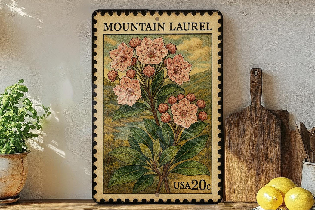 A framed vintage postage stamp depicting a pink flower plant, placed on a shelf next to a wooden cutting board and a potted plant.