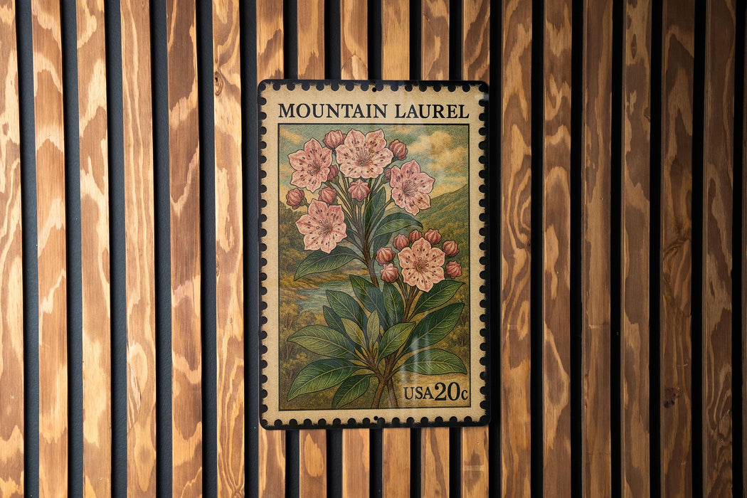 A vintage-style postage stamp from the United States, featuring a floral illustration of pink flowers against a wood-paneled background.