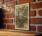 A vintage postage stamp featuring a detailed illustration of a berry plant on a brick wall.