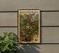 A postage stamp featuring a detailed illustration of a berry plant with red berries and green leaves, mounted on a wall.