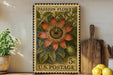 A vintage U.S. postage stamp featuring a vibrant illustration of a passion flower, placed on a wooden surface next to a wooden cutting board and a potted plant.