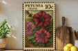 A framed illustration of a red flower on a shelf, with a potted plant to the left and a wooden cutting board to the right.