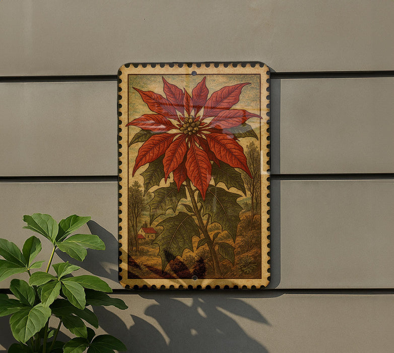 a large, vibrant red poinsettia flower with green leaves, displayed on a wall.