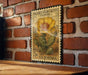 A vintage U.S. postage stamp featuring a yellow pear cactus flower is displayed on a brick wall.