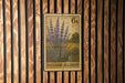 A 6-k stamp featuring a floral design is displayed on a wooden wall.