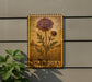 a wooden sign with a floral design, mounted on a wall next to a plant.