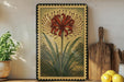 a framed illustration of a red flower with long petals, placed on a shelf next to a wooden cutting board and a potted plant.