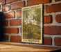 A vintage U.S. postage stamp featuring a floral illustration is displayed on a brick wall.