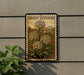 a decorative sign with a floral illustration, mounted on a wall next to a plant.