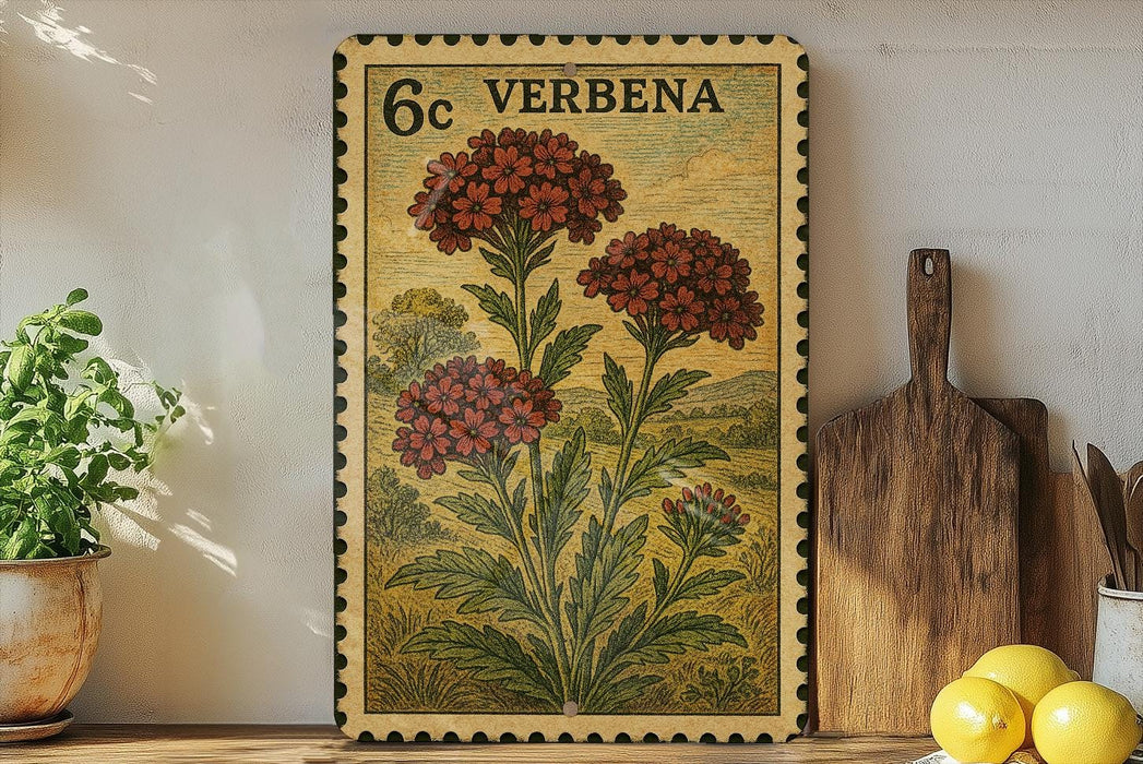 a framed print of a flower with the text "6c VERBENA" on it, placed on a shelf next to a wooden cutting board and some potted plants.