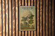 A postage stamp featuring a snowball plant on a wooden background.