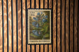 A United States postage stamp featuring a bluebell flower, mounted on a wooden wall.