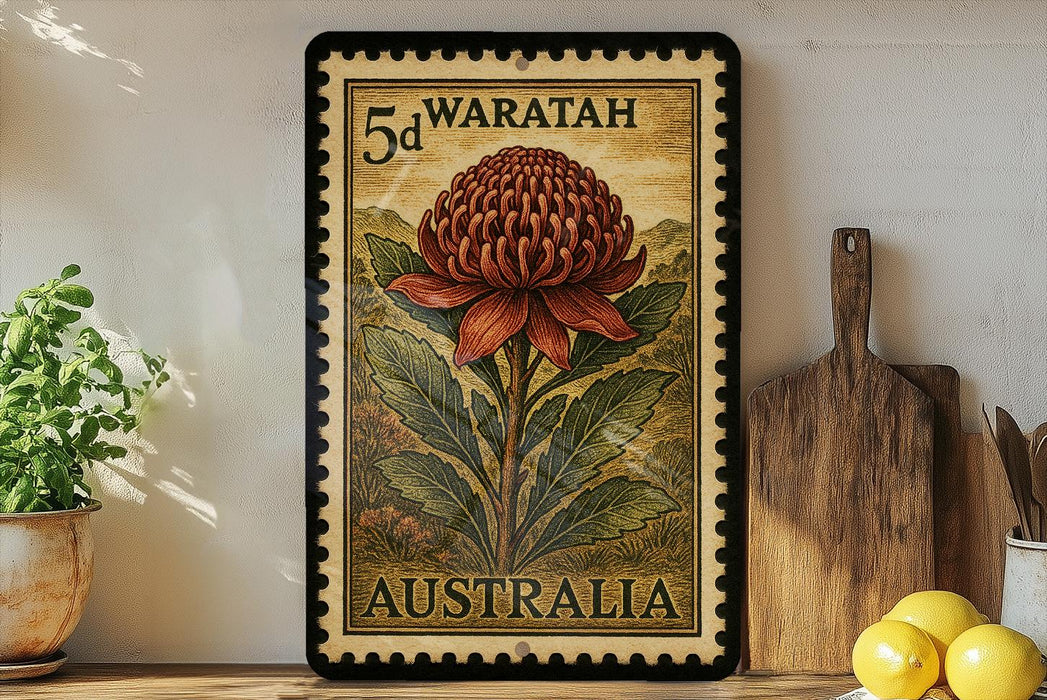 A framed stamp depicting a large red flower, likely a waratah, is displayed on a shelf next to a wooden cutting board and some kitchen utensils.