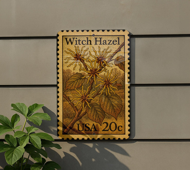a stamp with a plant illustration on it, mounted on a wall.