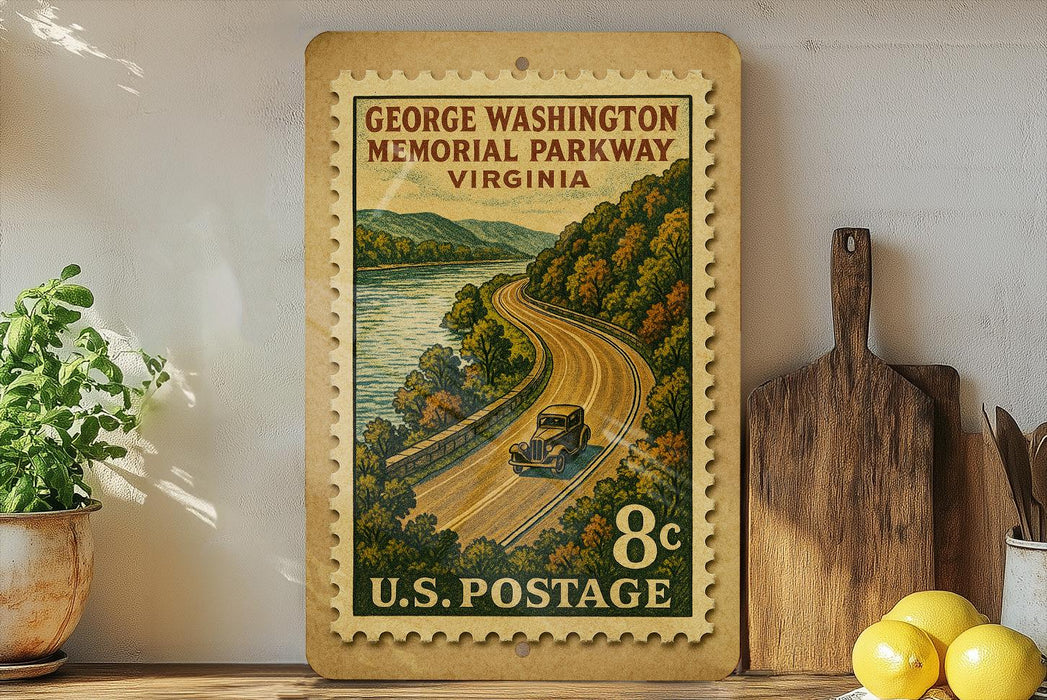 A vintage postage stamp depicting a scenic road winding through a mountainous landscape, with a small car traveling along the road. The stamp is mounted on a wooden surface, surrounded by various kitchen utensils and a potted plant.