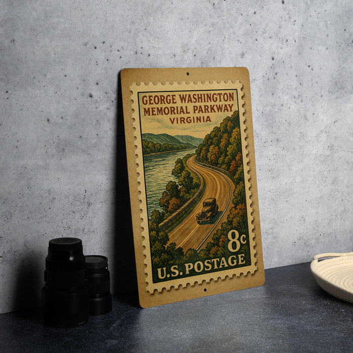 A vintage postage stamp depicting a scenic road leading to George Washington Memorial Parkway in Virginia, with a small car traveling along the road.