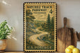 A vintage postage stamp depicting a winding road through a forest, with the text "NATCHEZ TRACK PARKWAY TENNESSEE 4c U.S. POSTAGE" printed on it.