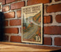 A vintage U.S. postage stamp depicting a scenic drive in Minnesota, mounted on a brick wall.