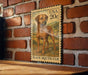 A wooden table with a framed image of a dog, which appears to be a postage stamp depicting a dog.