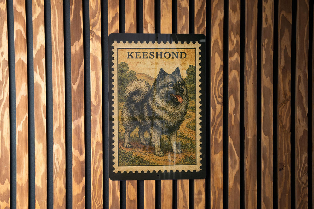 A framed illustration of a dog, specifically a Keeshond, is displayed on a wooden wall.