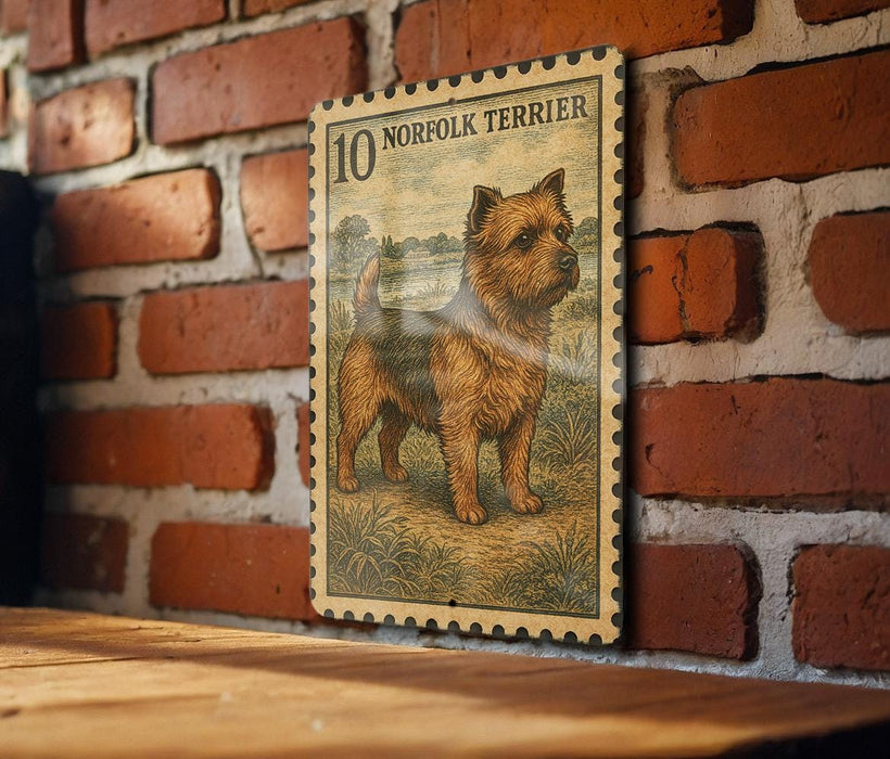 a framed illustration of a dog, specifically a Norfolk Terrier, mounted on a brick wall.