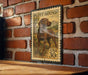 A vintage-style stamp depicting a hound dog, likely a Plot Hound, is displayed on a brick wall.