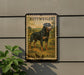 A metal sign featuring a rottweiler dog in a field, with the text "ROTTWEILER DEUTSCHLAND" printed on it.
