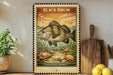 a vintage-style stamp depicting a fish, with the text "BLACK DRUM" and "PAGONIAS CROMIS" printed on it. The stamp is placed on a shelf next to a wooden cutting board and a potted plant.