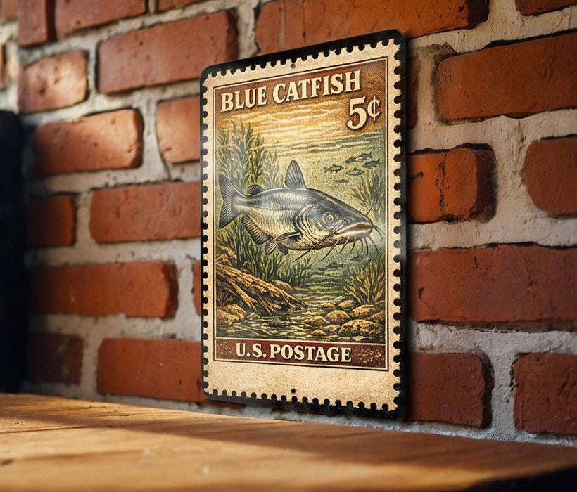 A vintage-style postage stamp featuring a blue catfish, mounted on a brick wall.