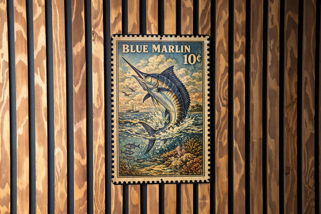 A vintage blue marlin postage stamp is displayed on a wooden wall.
