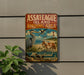 A vintage metal sign for Assateague Island Birding Area in Maryland, featuring illustrations of various birds and a lighthouse.