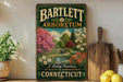 A vintage-style sign for Bartlett Arboretum in Connecticut, featuring a garden scene with pink and white flowers, a bridge, and a tree.