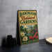 A vintage-style metal sign for the Birmingham Botanical Gardens in Birmingham, Alabama, featuring a garden scene with flowers and a building.