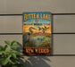 A vintage-style metal sign for the Bitter Lake National Wildlife Refuge in New Mexico, featuring a large heron and ducks in a grassy area with mountains in the background.