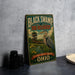 A vintage-style metal sign for the Black Swamp Bird Observatory in Ohio, featuring an illustration of a bird and a wooden structure.
