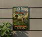 A vintage-style metal sign for the Black Swamp Bird Observation in Ohio, featuring a large heron and a wooden observation tower.